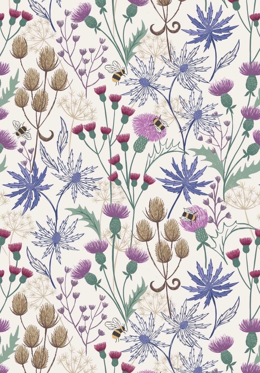 Celtic Floral fabric in Cream from A Celtic Summer collection by Lewis and Irene features buzzing bees in a floral meadow dotted with thistles against a sky blue background.