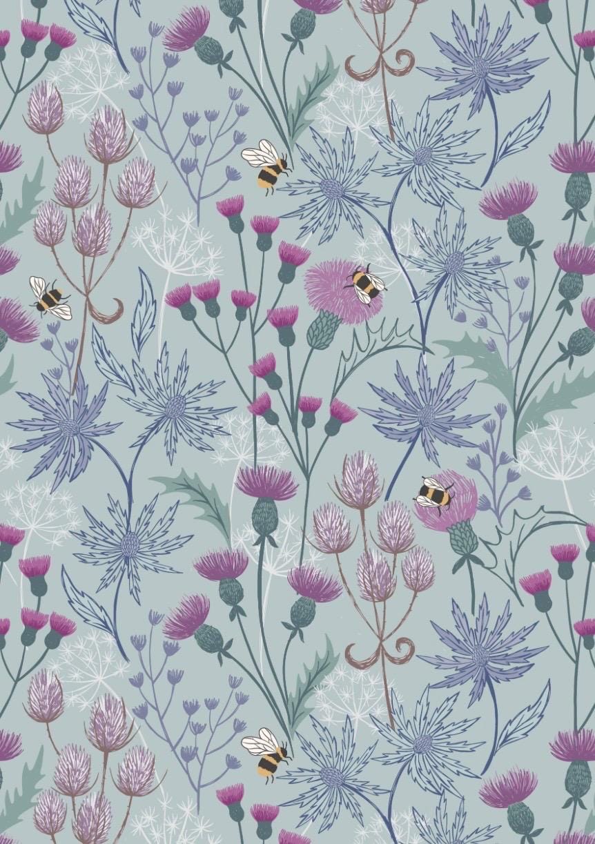 Celtic Floral fabric in Blue from A Celtic Summer collection by Lewis and Irene features buzzing bees in a floral meadow dotted with thistles against a sky blue background.