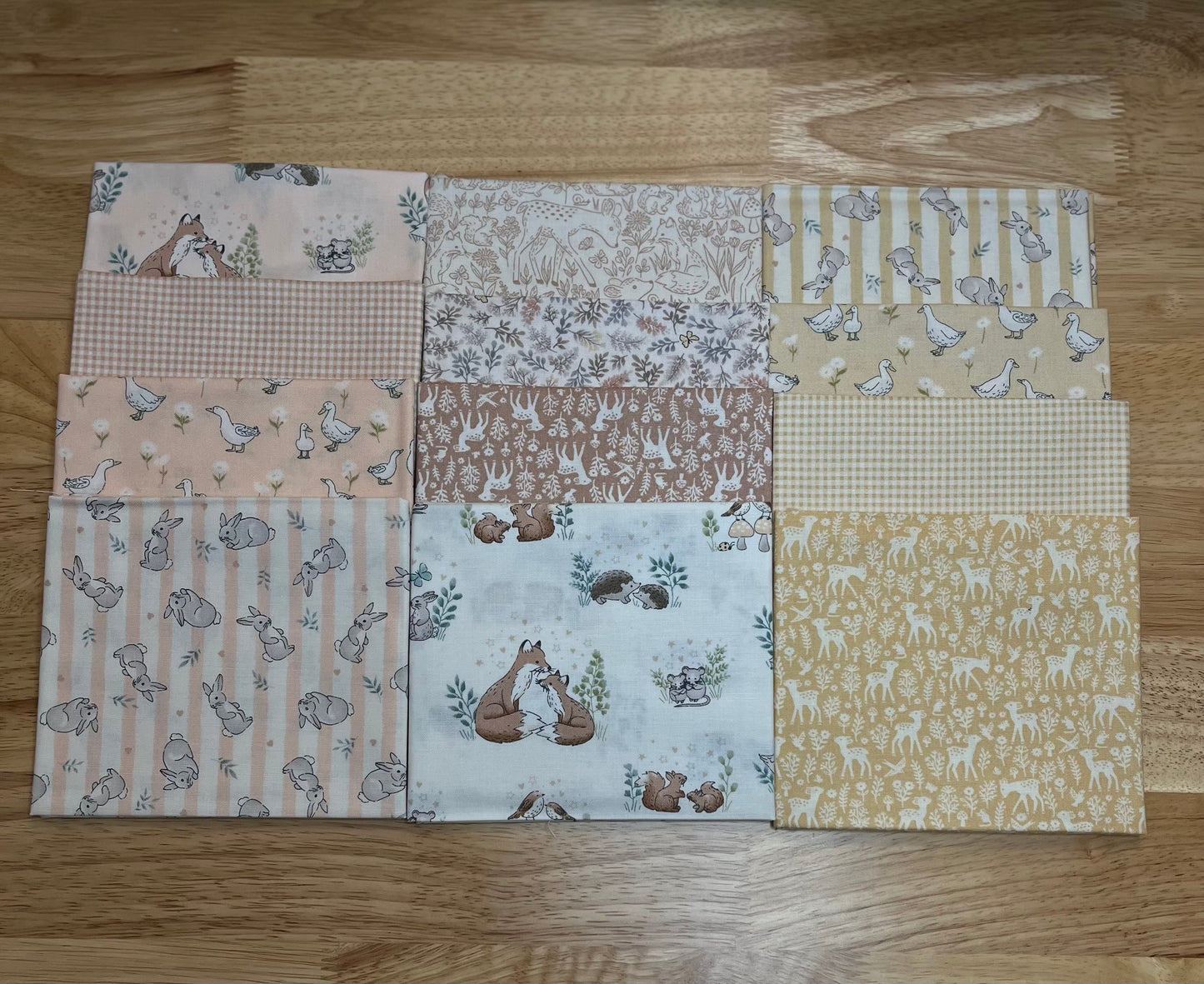 12 of the fabrics from the Little Ones collection from Makower UK and Andover come in charming shades of pale coral, dusty yellow, and woodsy brown, and feature cute critters like ducks, bunnies, deer, and foxes as well as tiny gingham fabrics to match.
