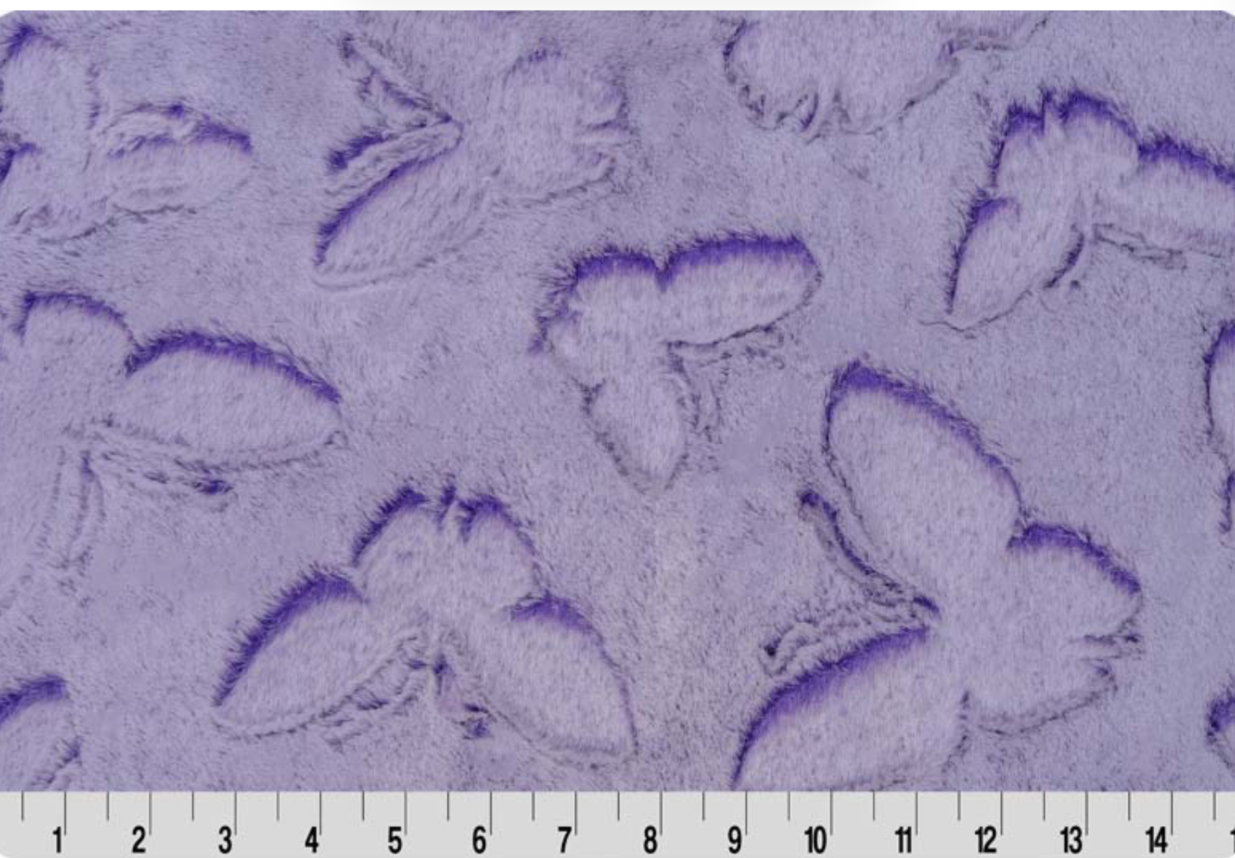 Luxe Cuddle Cut Frosted Butterfly in Lavender shown with a measuring tape to see embossed butterfly sizes.