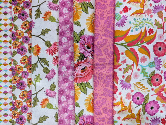 Seven brightly colored floral fabrics in pink and white inspired by the dazzling zinnia.